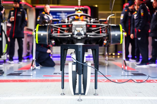 The Leica Absolute Tracker AT960 scanning the Red Bull Racing car in the Formula One pit lane.